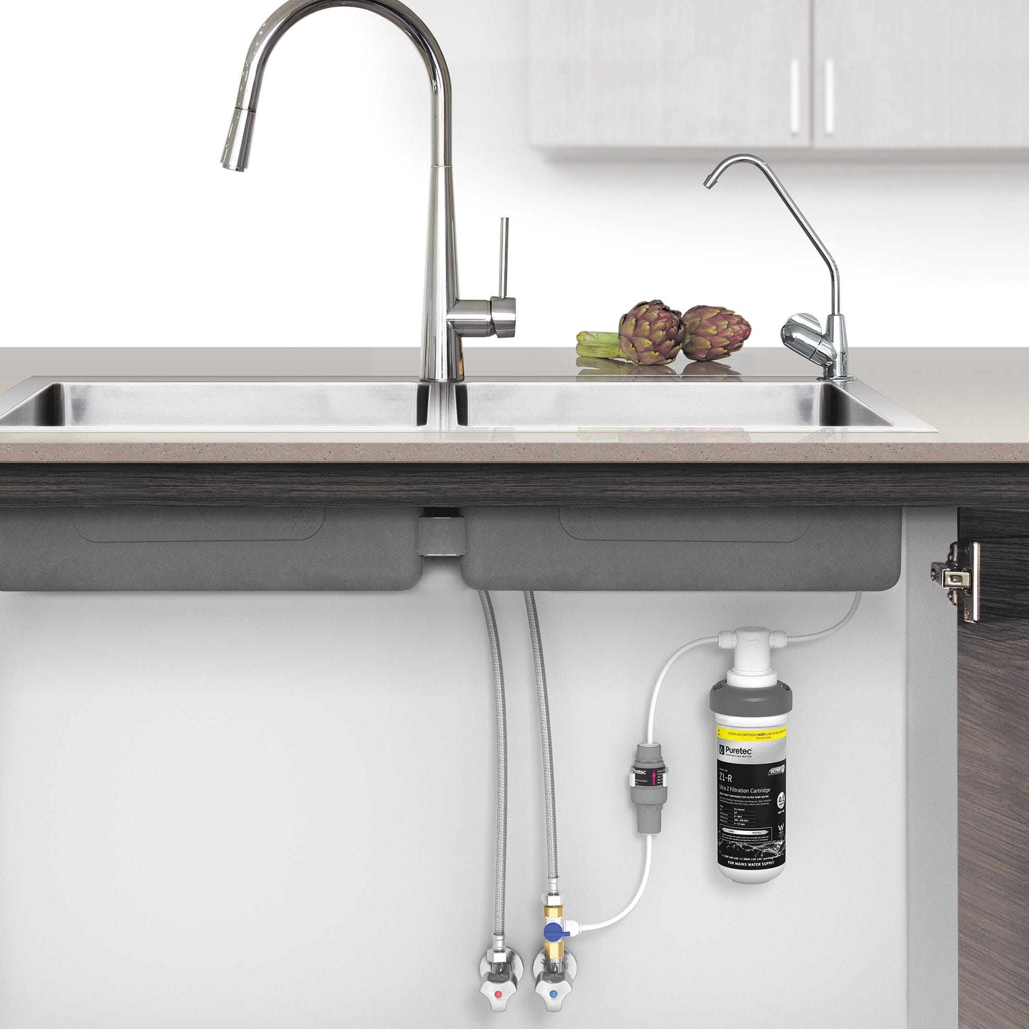 The z12 undersink filtration system is designed for drinking water applications. Installed in under a kitchen sink, it features a sleek chrome finish, ensuring high performance and reliability.